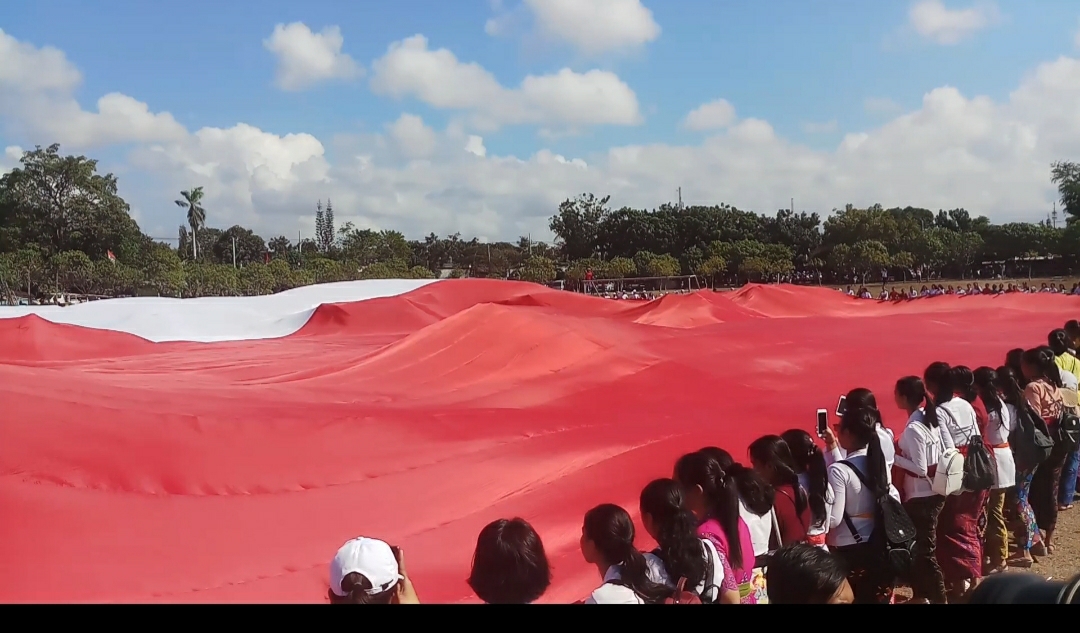Dokumentasi dari - Bendera Merah Putih Pencetak Rekor Muri Kembali Dibentangkan Ribuan Siswa di Bali